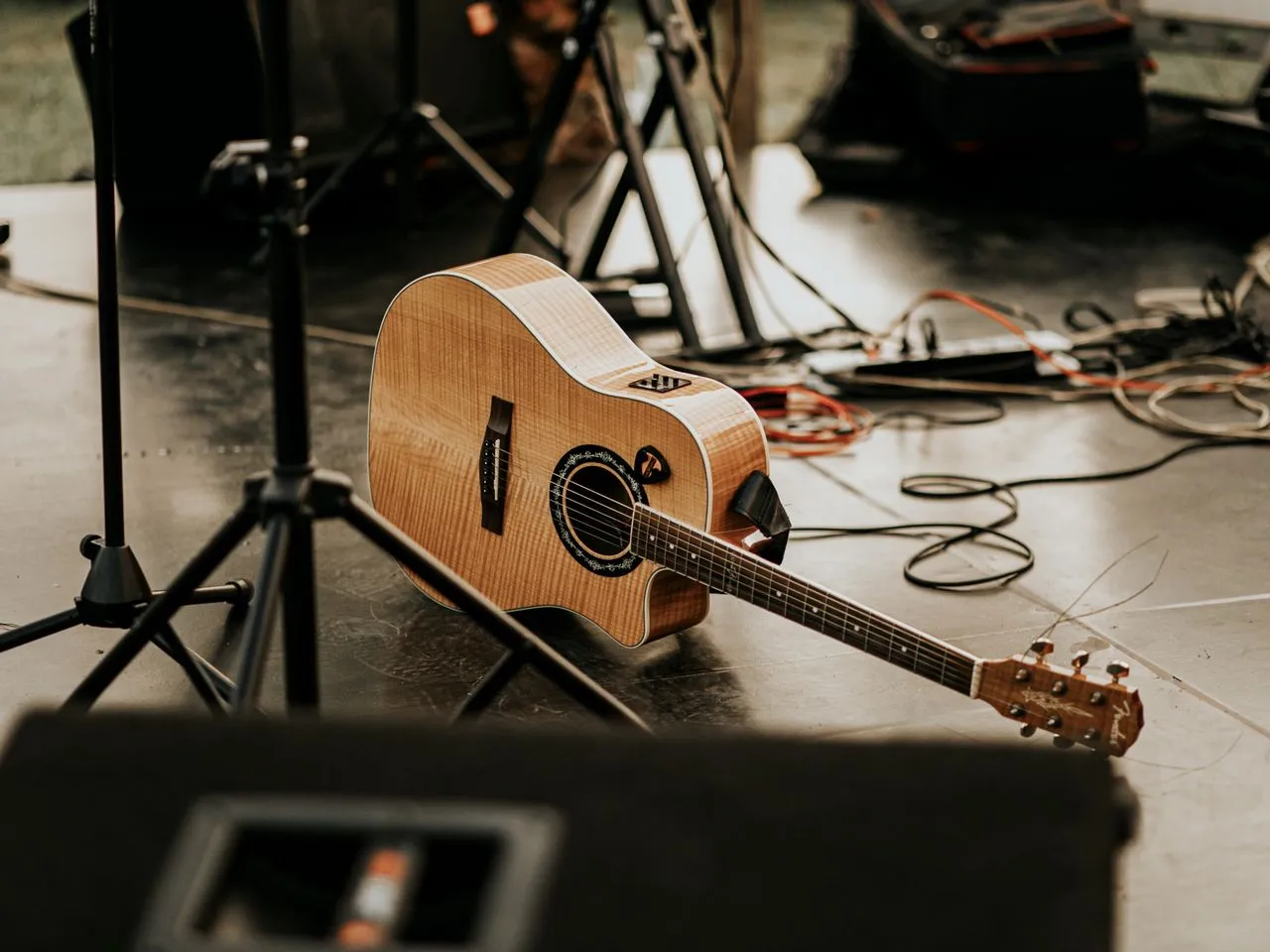 Live music setup with guitar and stage equipment