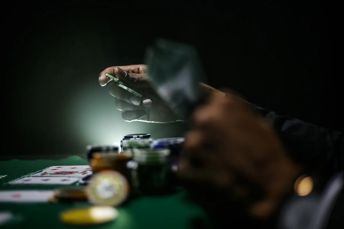 Event host preparing chips at a gaming table